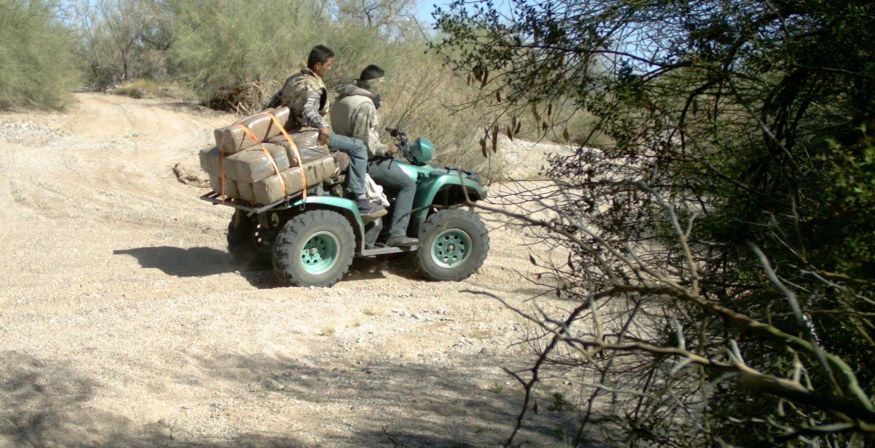 Two employees of “Memo” on an ATV with several bundles of marijuana wrapped in brown tape passed by in the middle of the day. Nearly every day of the week Memo and his organization were smuggling some sort of drug into the US via the Pipeline route.
