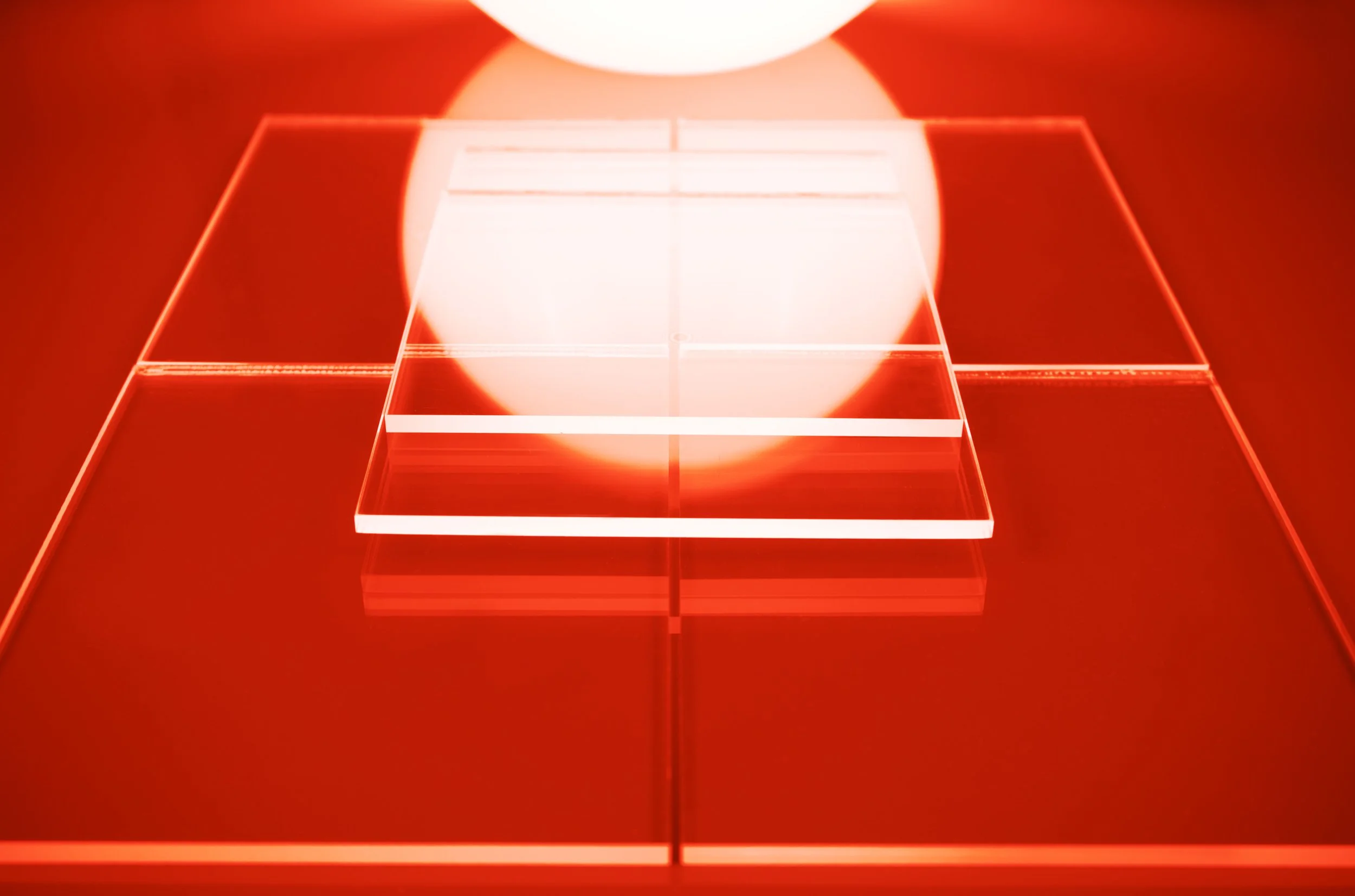 Surreal fine art print of a radiant white sun sphere glowing above a vivid orange geometric landscape. Warm and monumental.