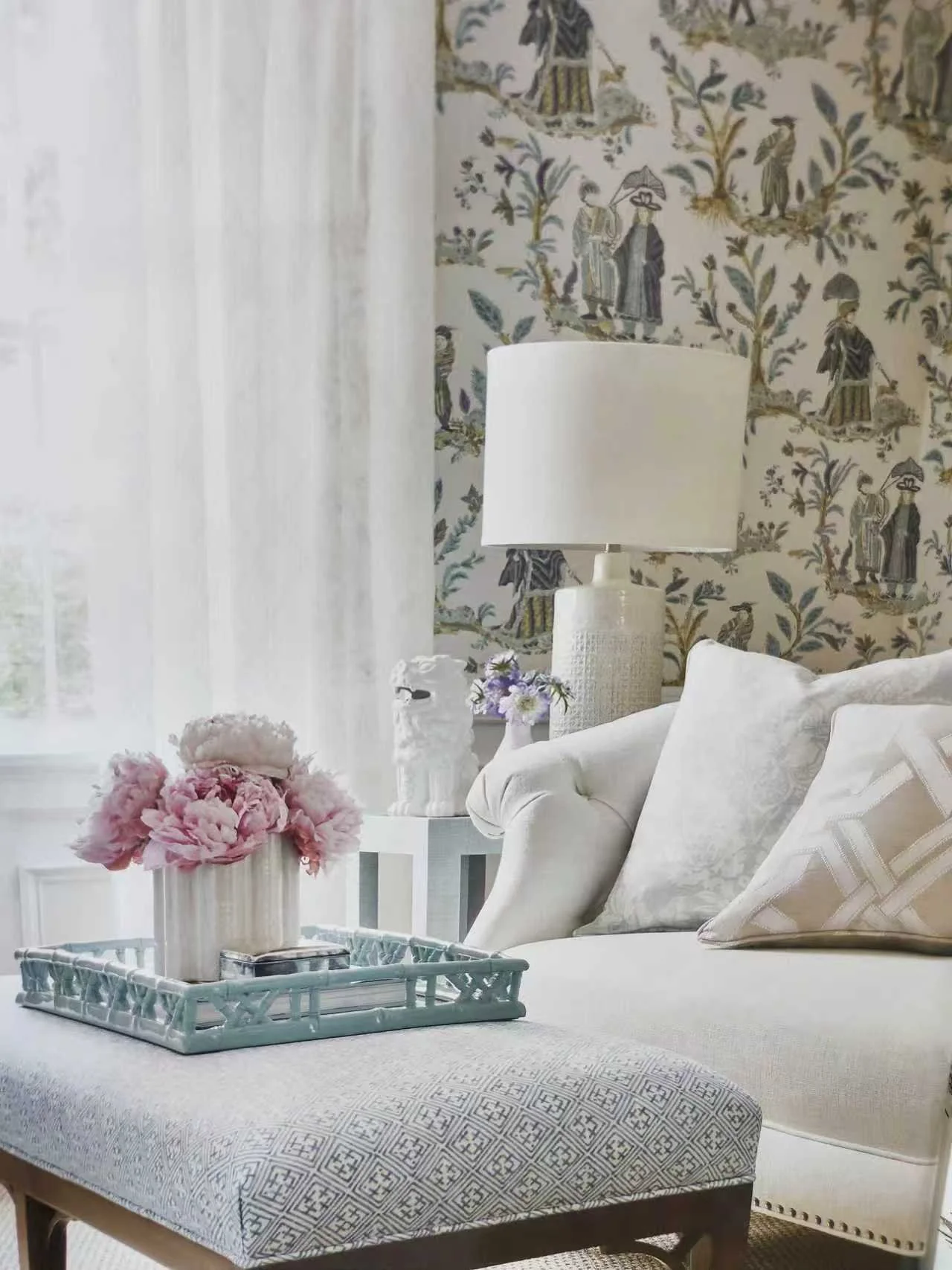 Elegant living room complimented by lovely sheer curtains filtering the natural light