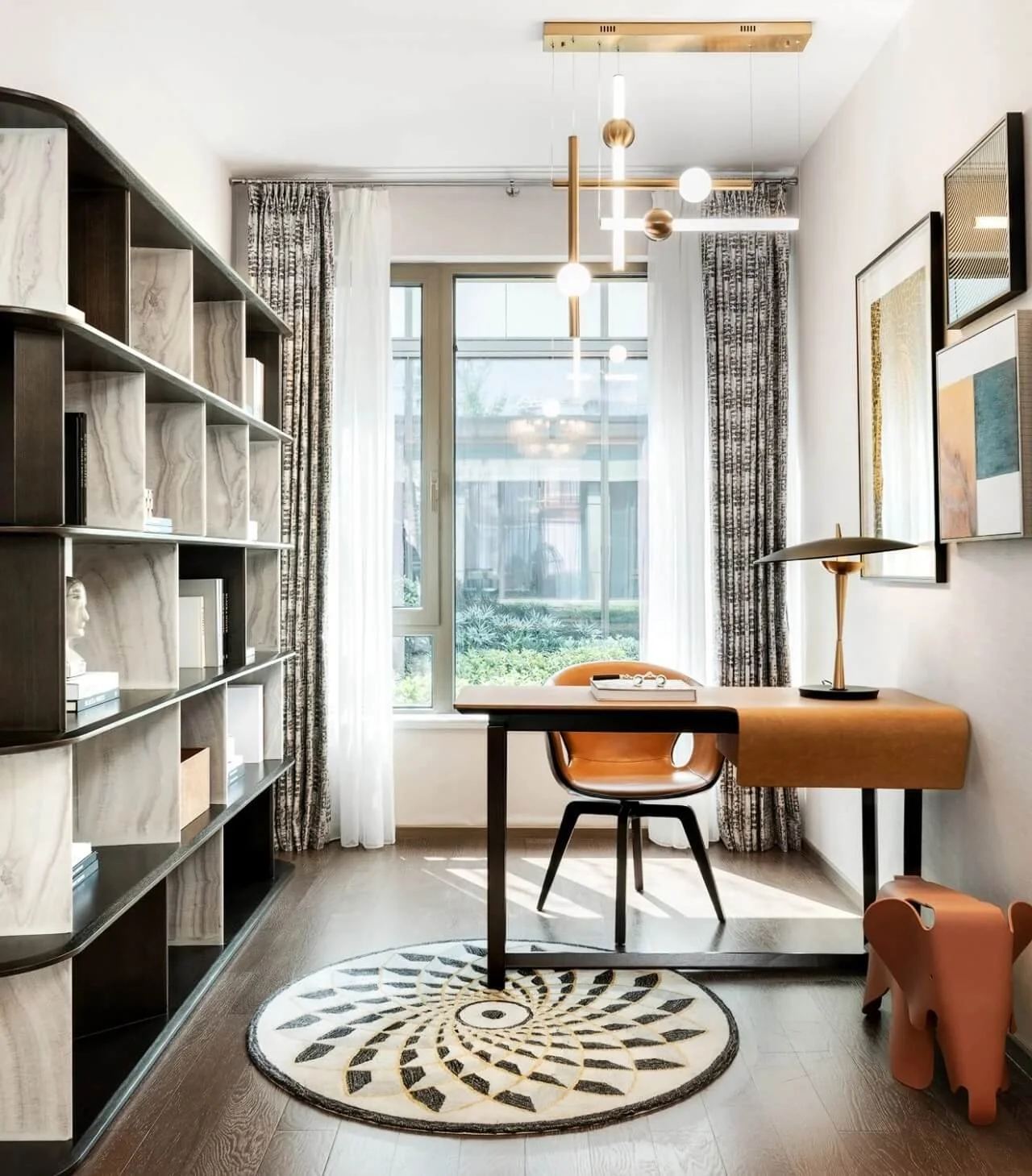 Bright modern home office or study with large window complimented by stylish patterned and sheer curtains