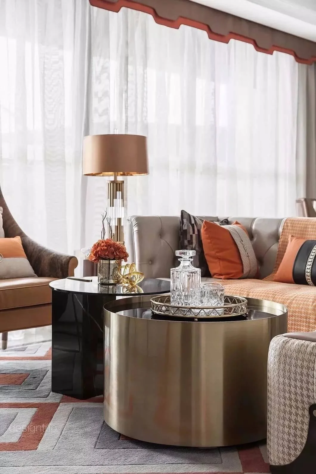 Modern living room with orange accents complimented by sheer curtains and an orange and beige pelmet.