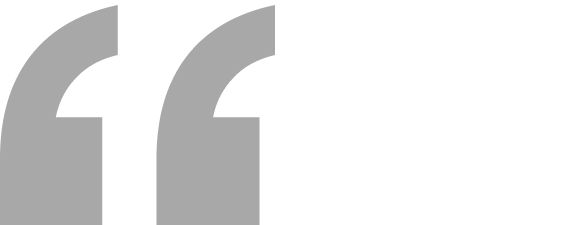 A person holding a microphone on stage.