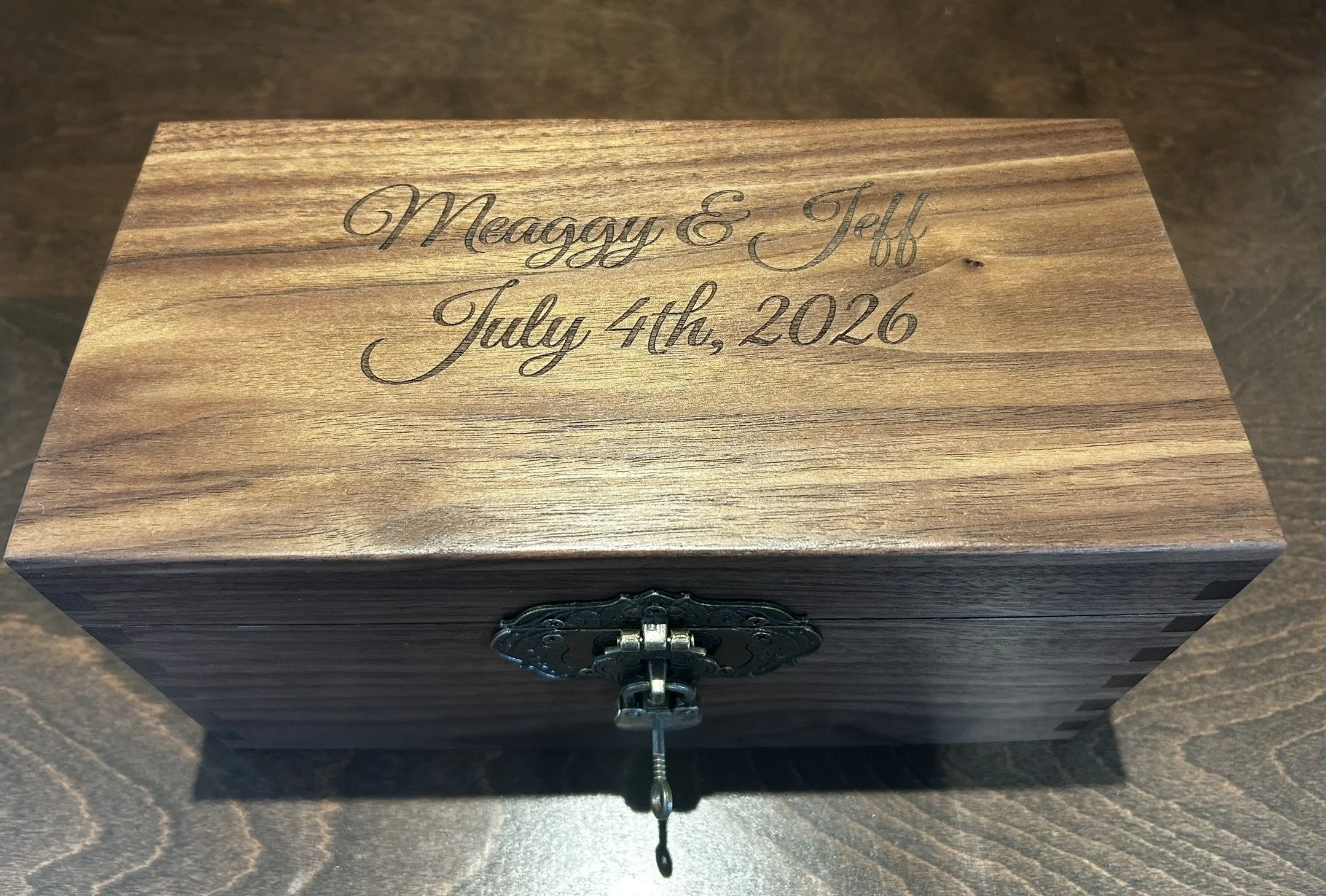 Personalized walnut wedding keepsake box with engraved names and date