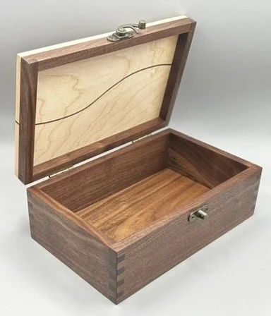 Open handcrafted walnut keepsake box showing solid hardwood interior