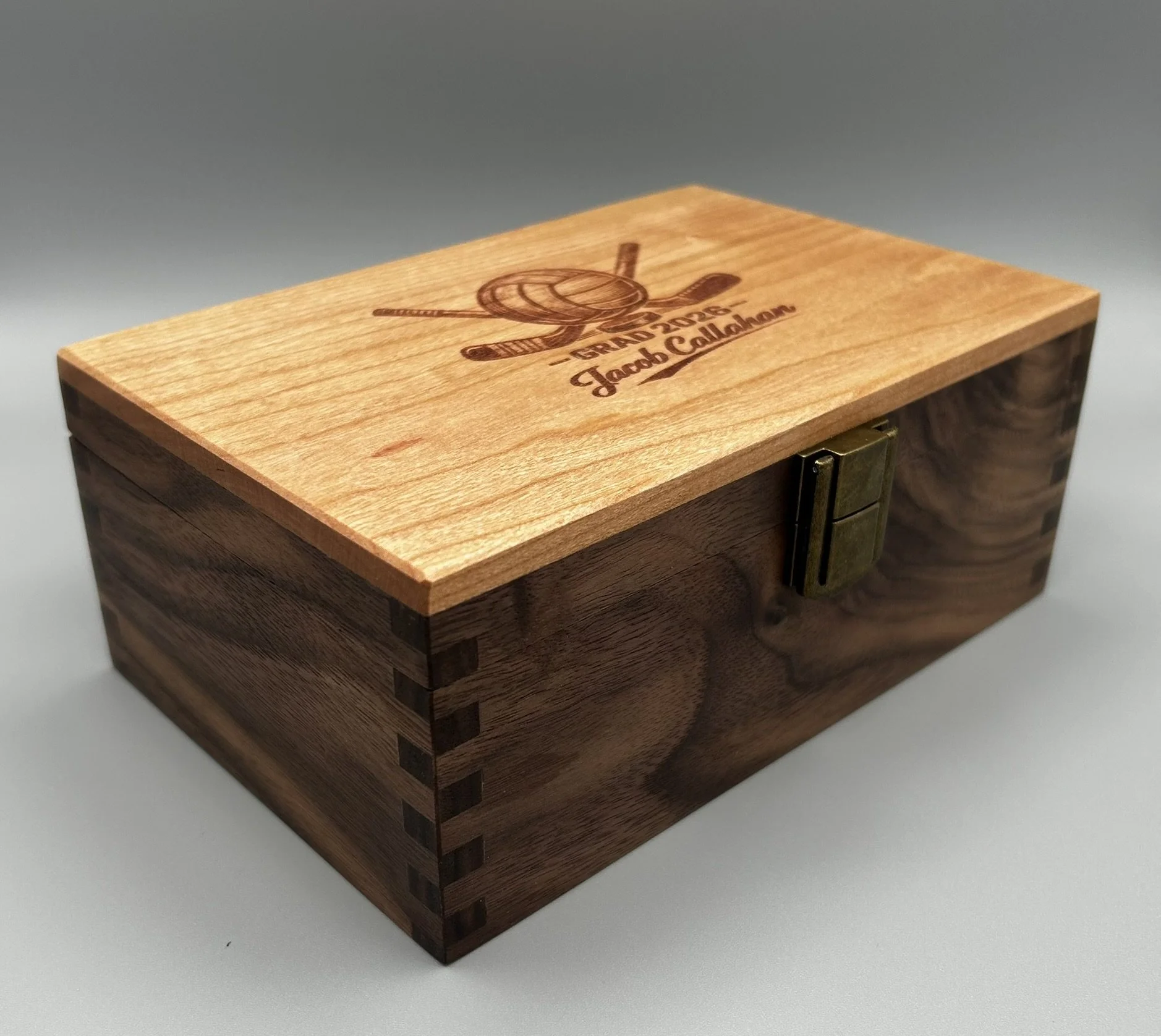 Personalized walnut keepsake box with custom hockey and soccer engraving