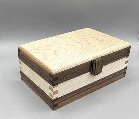 Handcrafted walnut and maple keepsake box with contrasting hardwood design