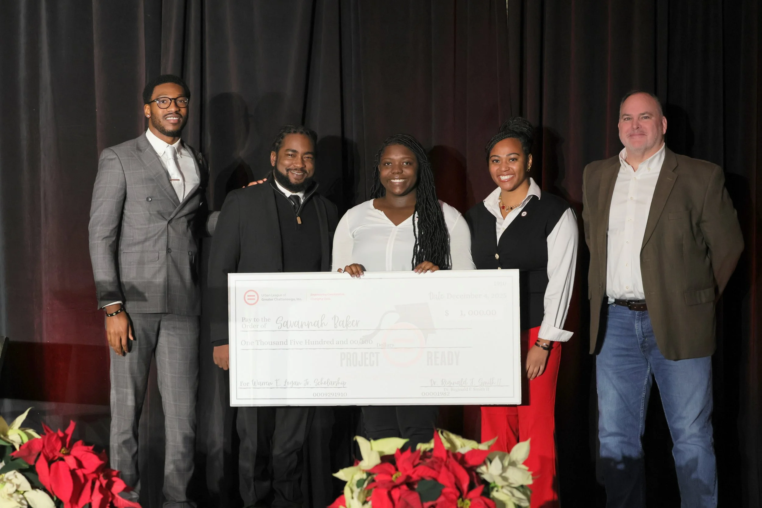 Savannah Baker of Chattanooga School for the Arts and Sciences  pictured holding Warren E. Logan, Jr. NAS Scholarship check for $1500
