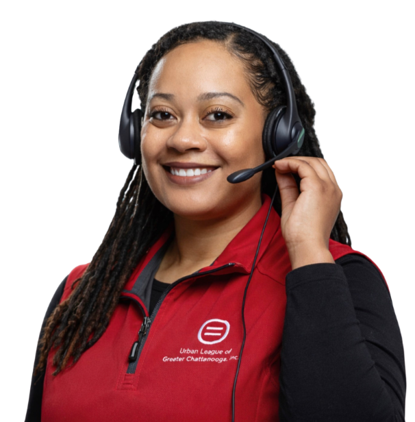 a smiling woman wearing a black headset with a microphone and a red jacket with a logo that says Urban League of Greater Chattanooga, Inc.