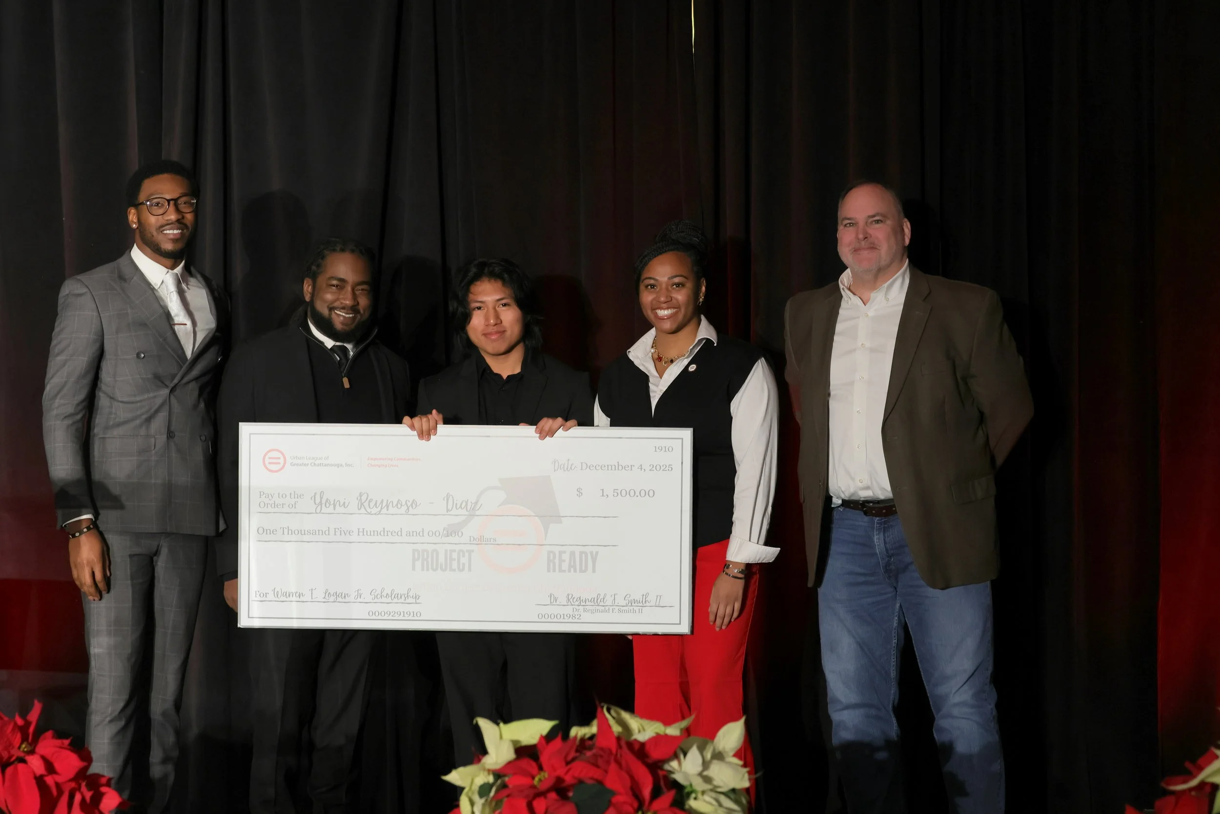 Yoni Reynoso-Diaz of Howard High School pictured holding Warren E. Logan, Jr. NAS Scholarship check for $1500