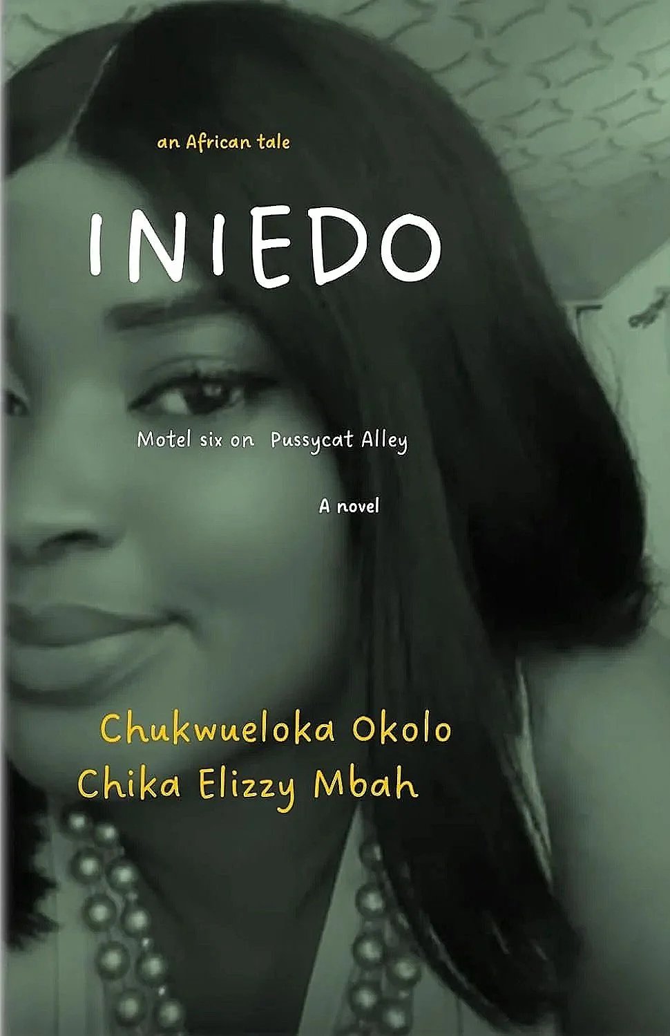 Close-up of a woman with dark hair and pearl necklaces, featuring the book title 'Iniedo' and the subtitle 'an African tale,' along with the author's name 'Chukwueloka Okolo, Chika Elizzy Mbah.'