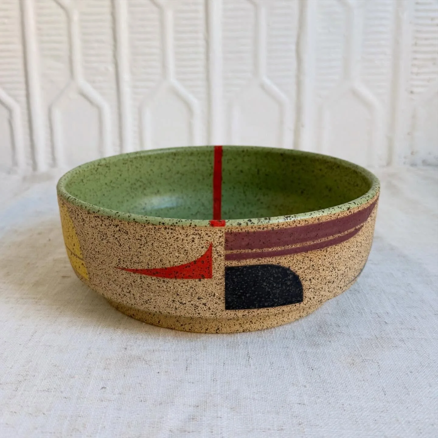 Wide, flat bowl in speckled stoneware with a geometric glaze pattern. Thrown and glazed by hand. So much fun pushing the limits with this deceivingly difficult form. 
.
.
.
#ceramics #pottery #handmadeceramics #speckledclay #functionalceramics