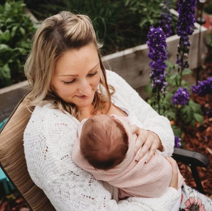 Krislyn Mulargia and newborn in the garden