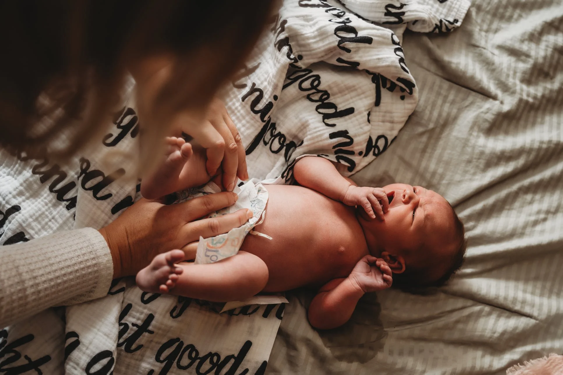 Krislyn Mulargia diapering a newborn