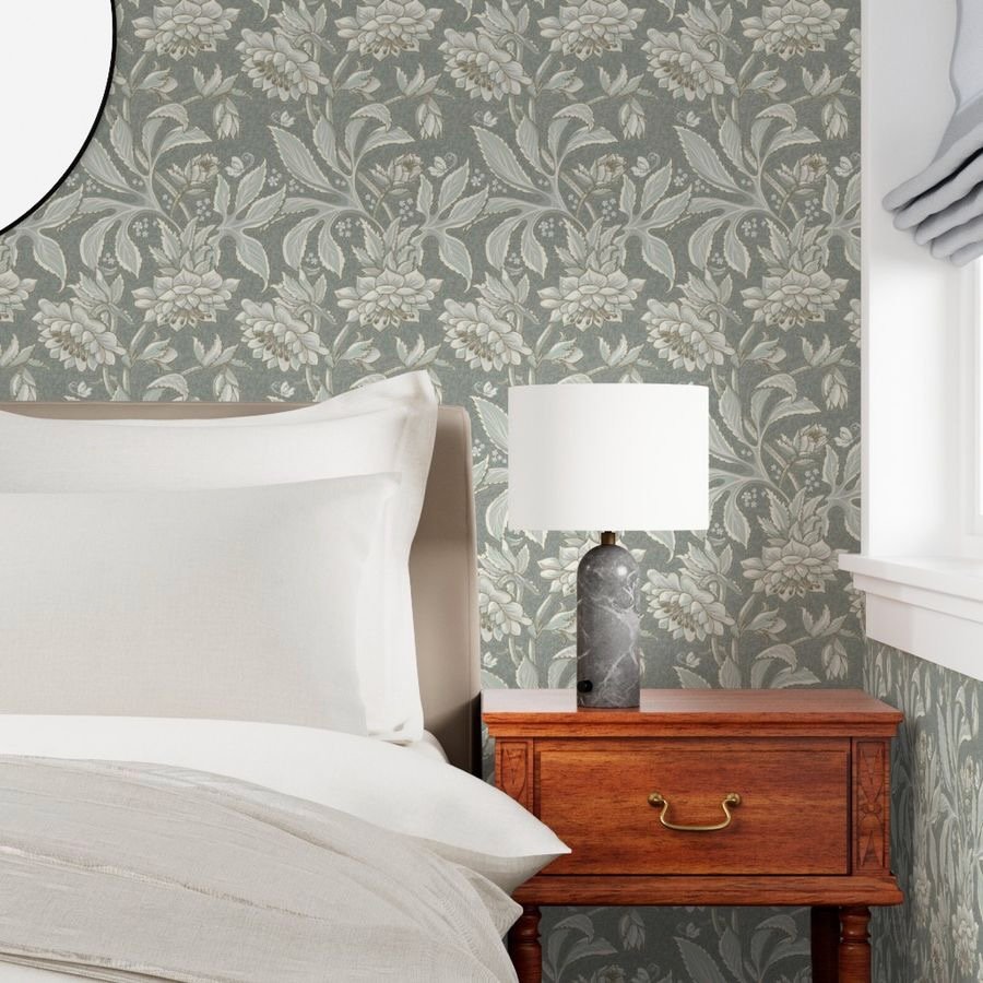 A bedroom featuring floral Hellebore Garden wallpaper from Wild Geranium Design's Victorian Evening Garden collection.