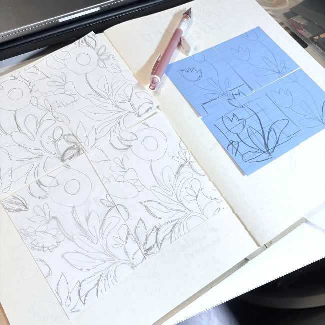 Hand drawing ornamental botanical motifs as part of the surface pattern repeat design process.