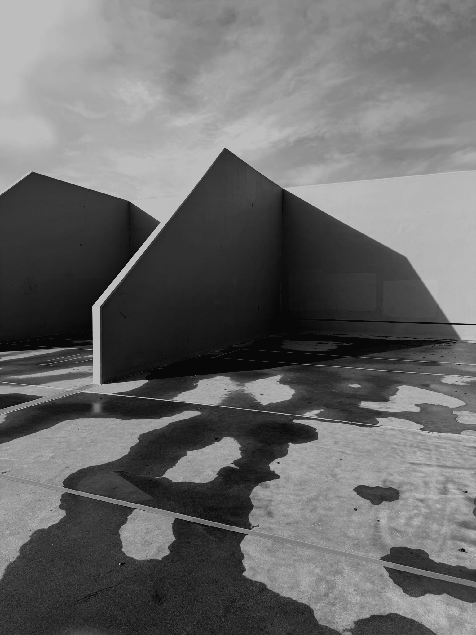 Brutalist concrete wall wet ground