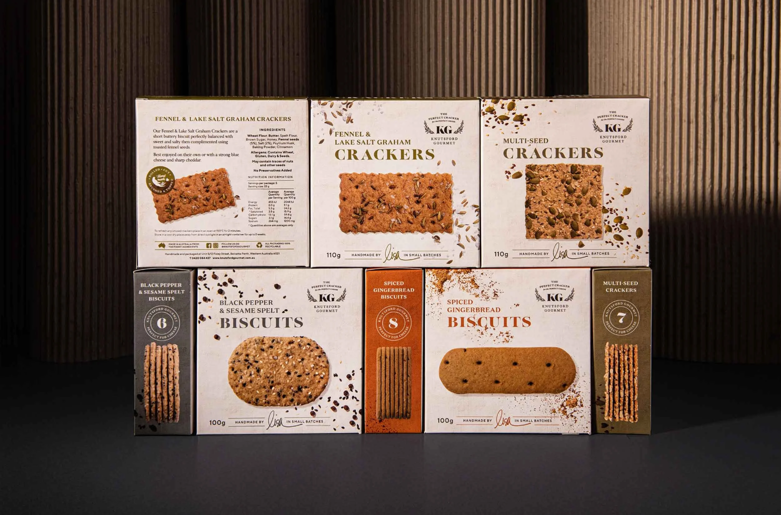 A stylished photograph of Knutsford Gourmet's cracker range, showing the front, back and sides of the packaging boxes