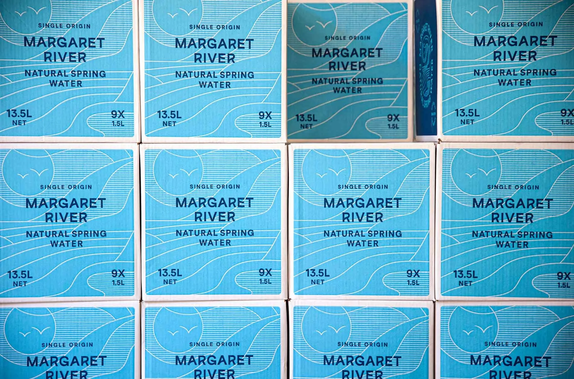 A photograph of the 1.5 litre cartons stacked on top of one another, the box design created by Dessein