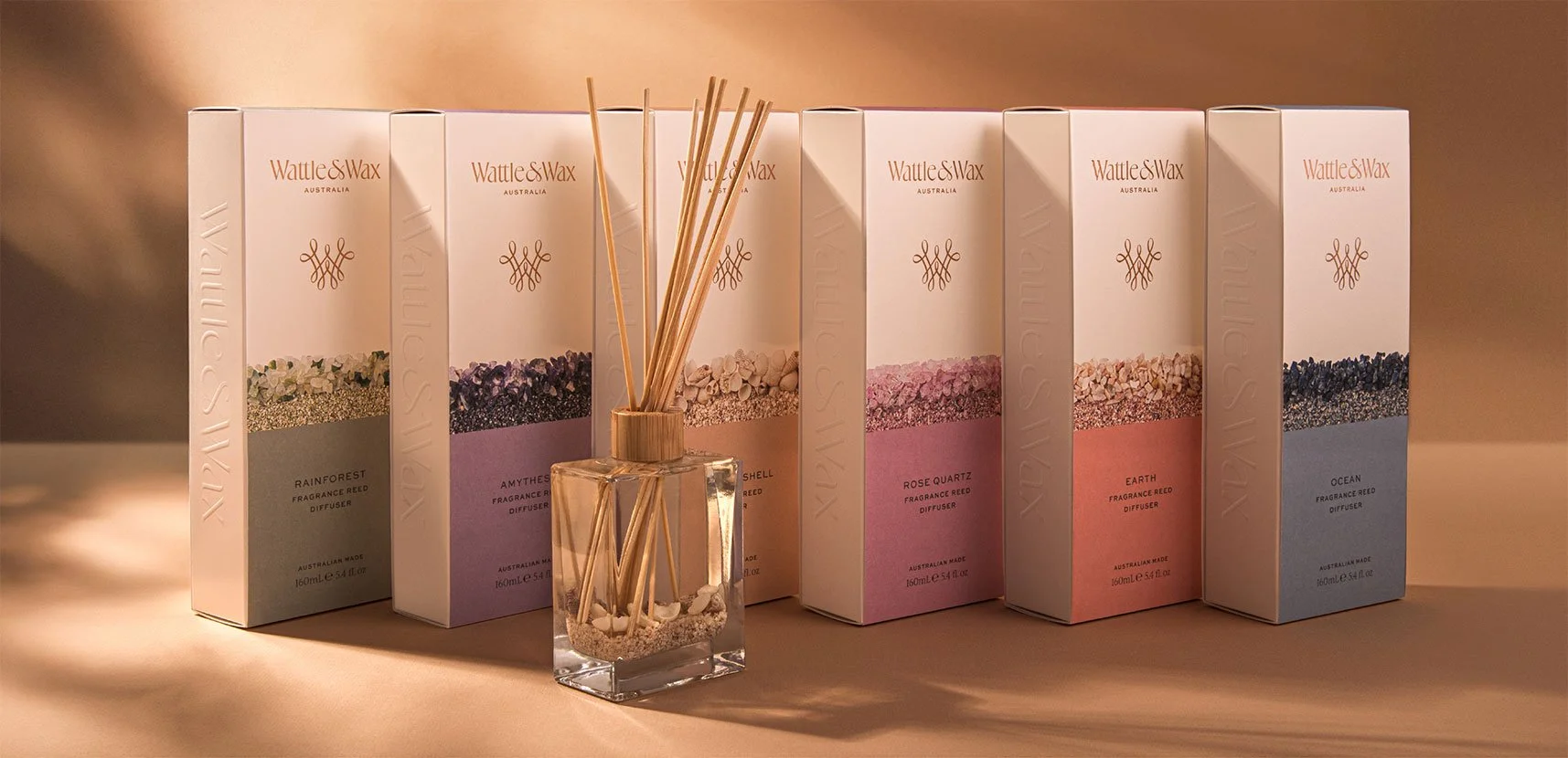 A photograph showing Wattle and Wax's reed diffuser product range