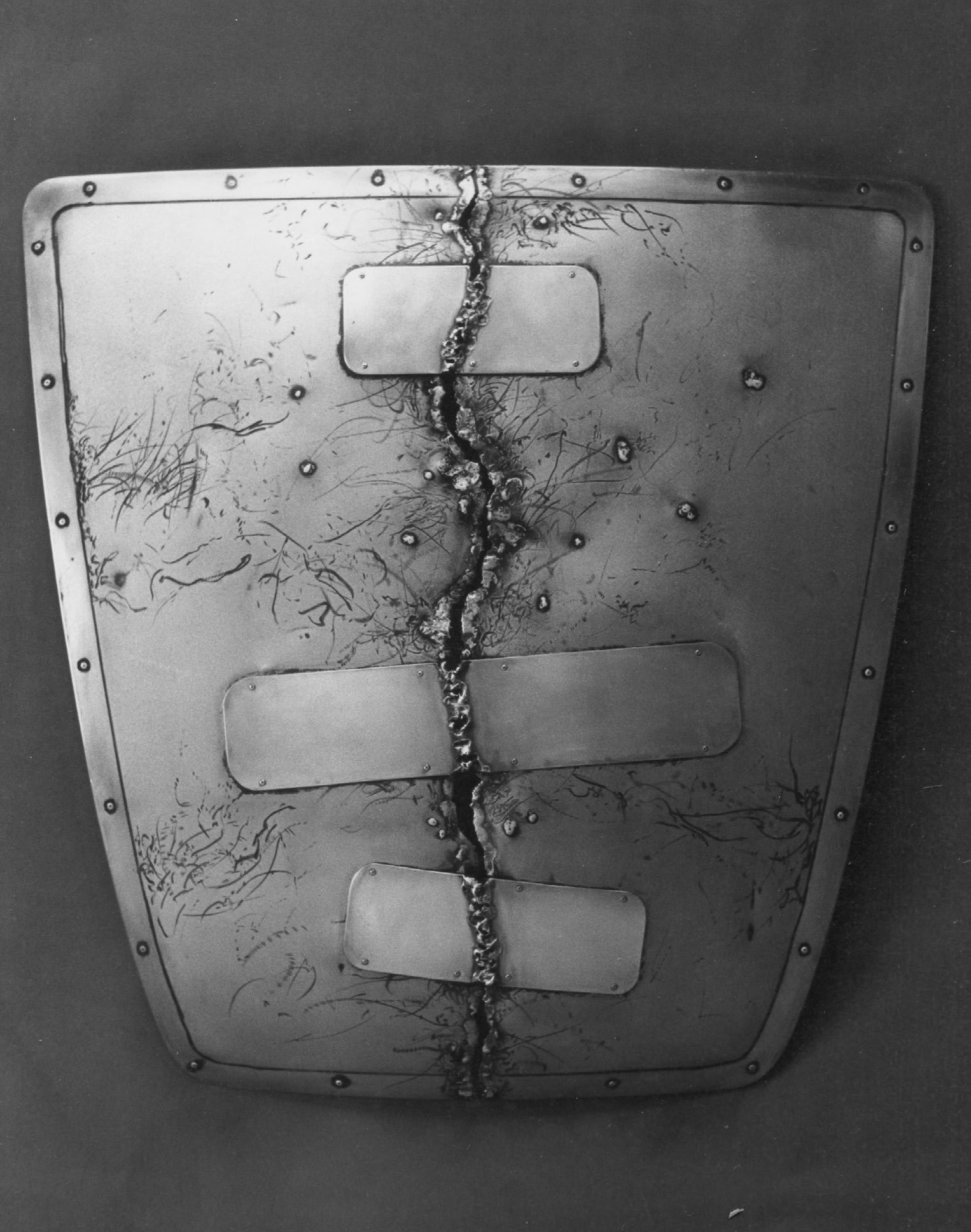 Shield Series X, 36 x 36 in., steel, aliminum, and brass