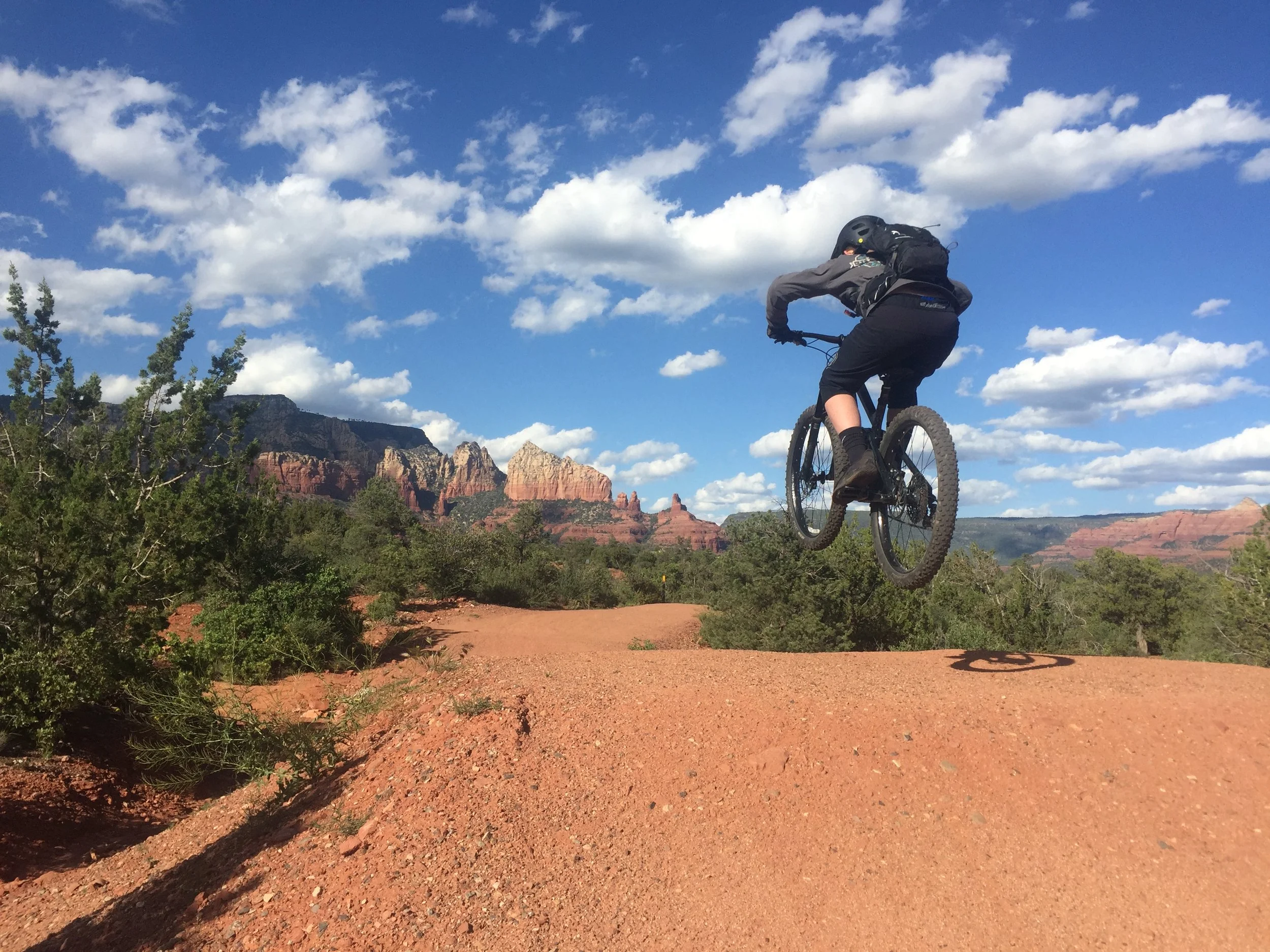 Youth rider hits a jump at the Sedona Bike Park