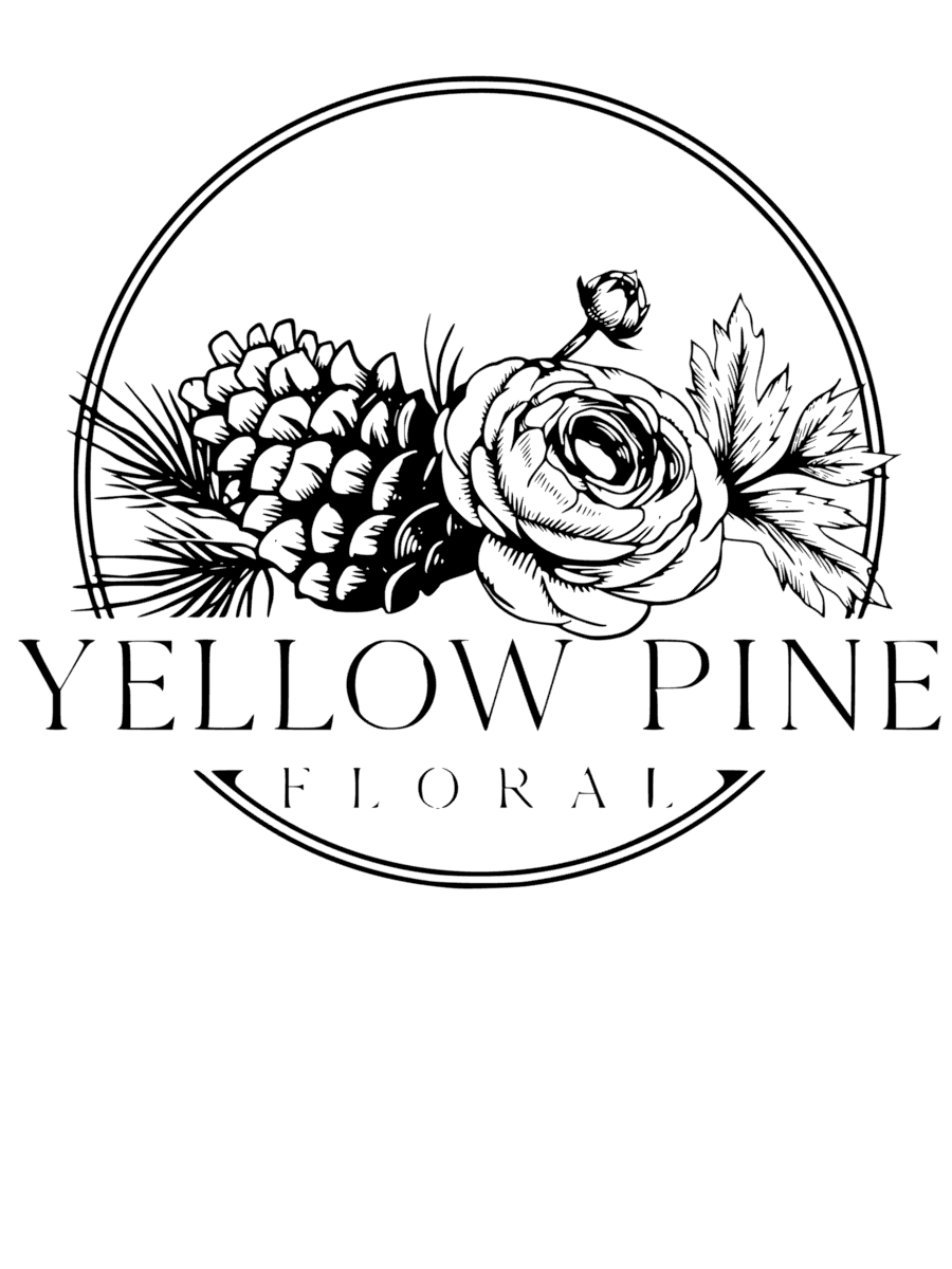 Black and white logo with a detailed illustration of a pine cone, pine branch, and a rose, with the text "Yellow Pine Floral" underneath.