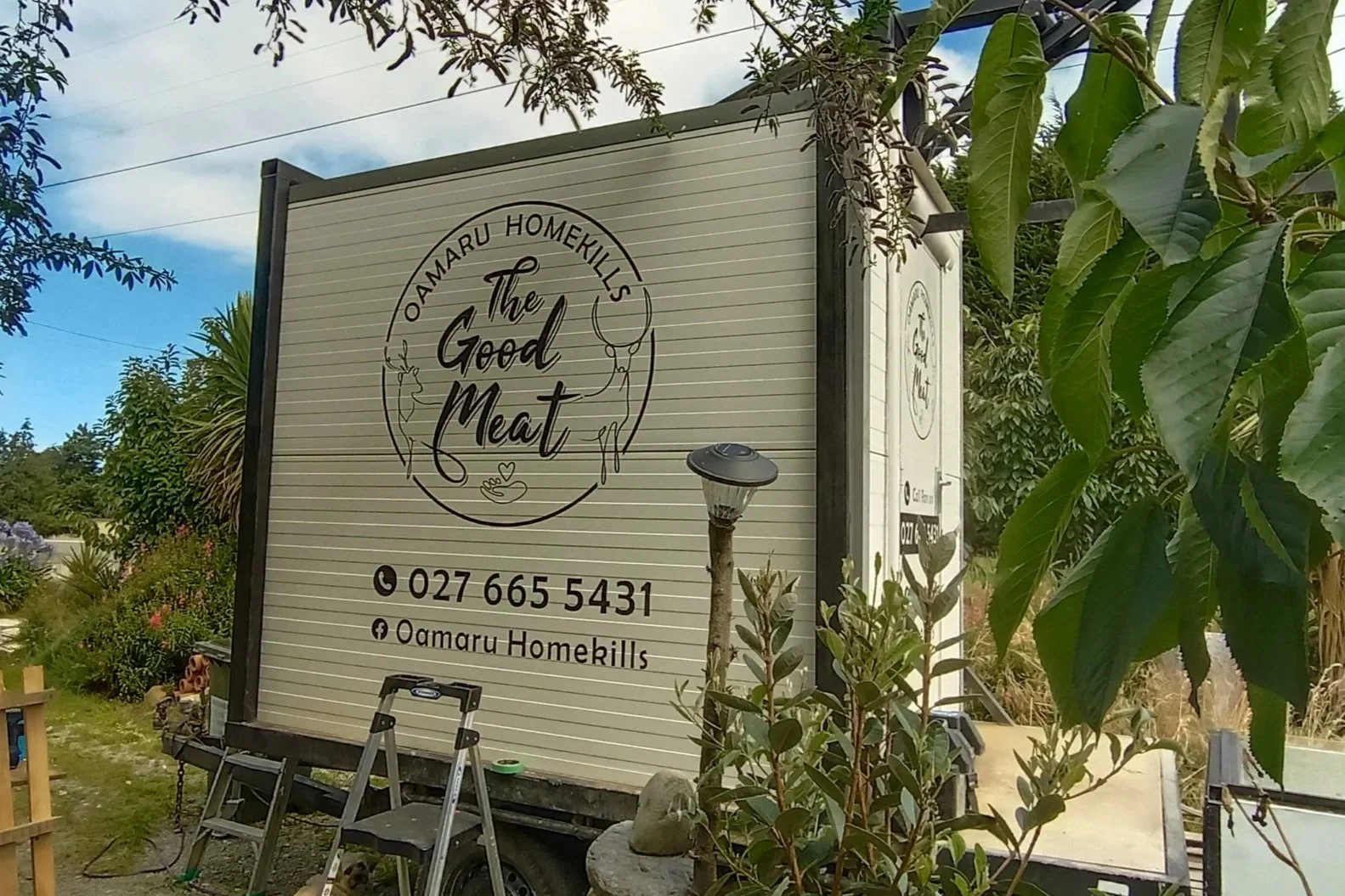 Logo design, cut and application of vinyl graphics to trailer