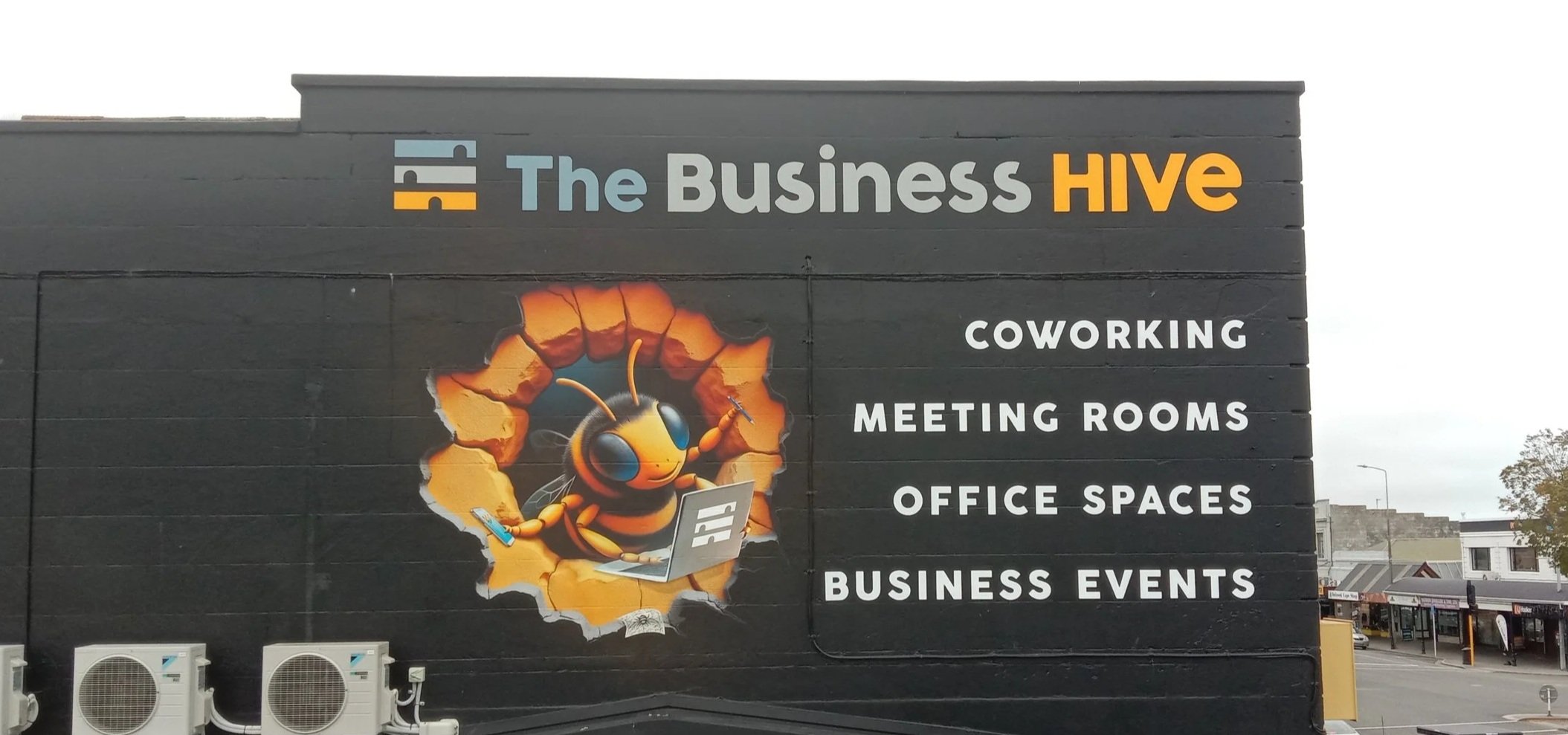 Full building signage fitout: hand-painted logo, vinyl wrap router cut letters and digitally printed multidrop print