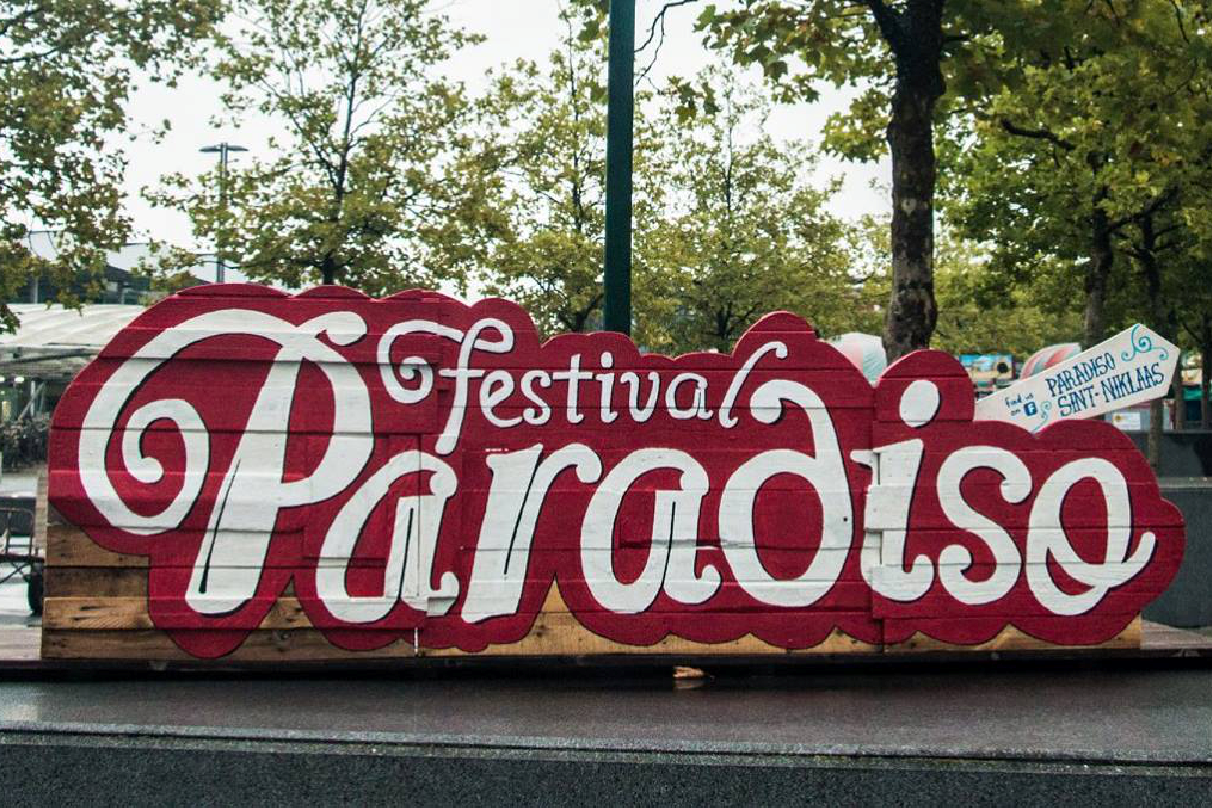 Festival entrance sign on recycled wood panels