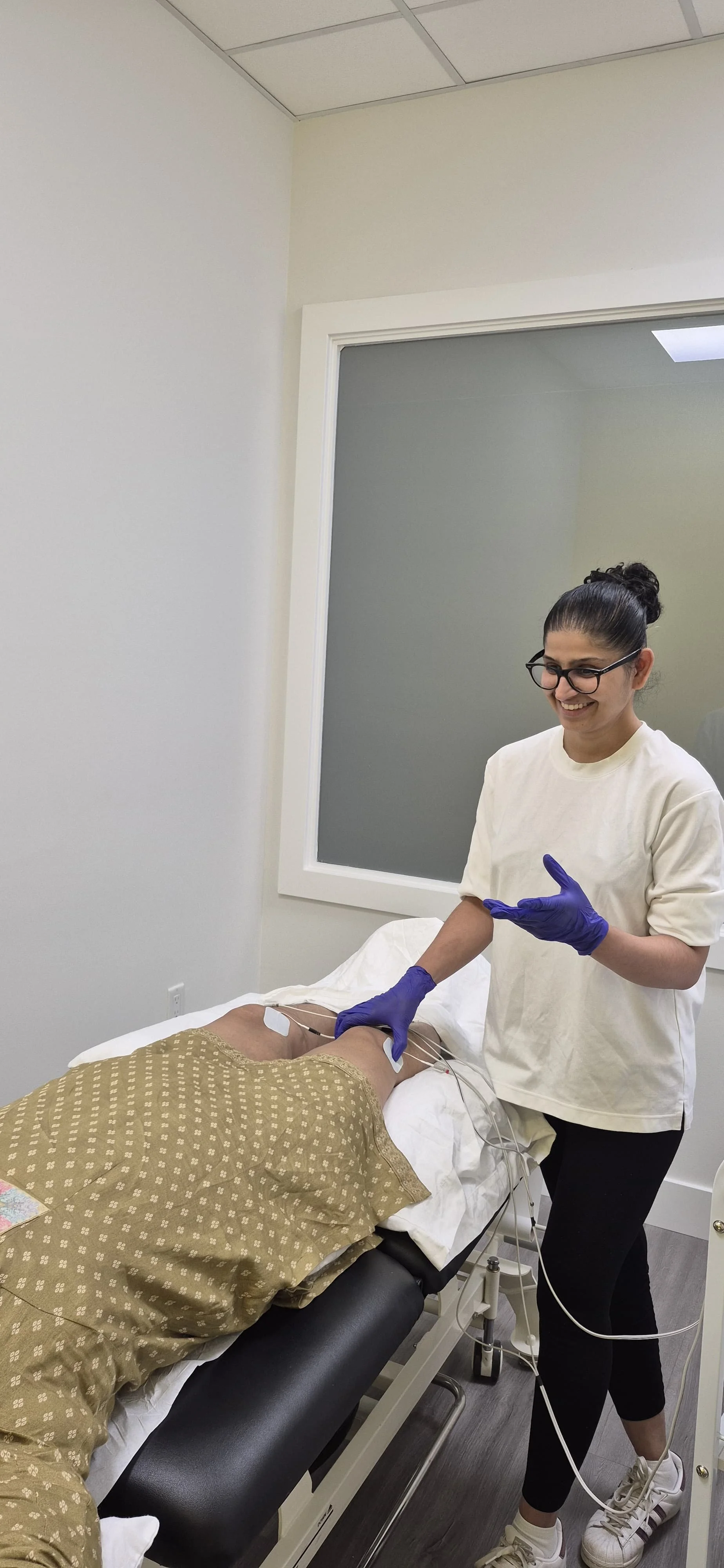 Physiotherapist applying electrotherapy during a treatment session at WellCare Physiotherapy