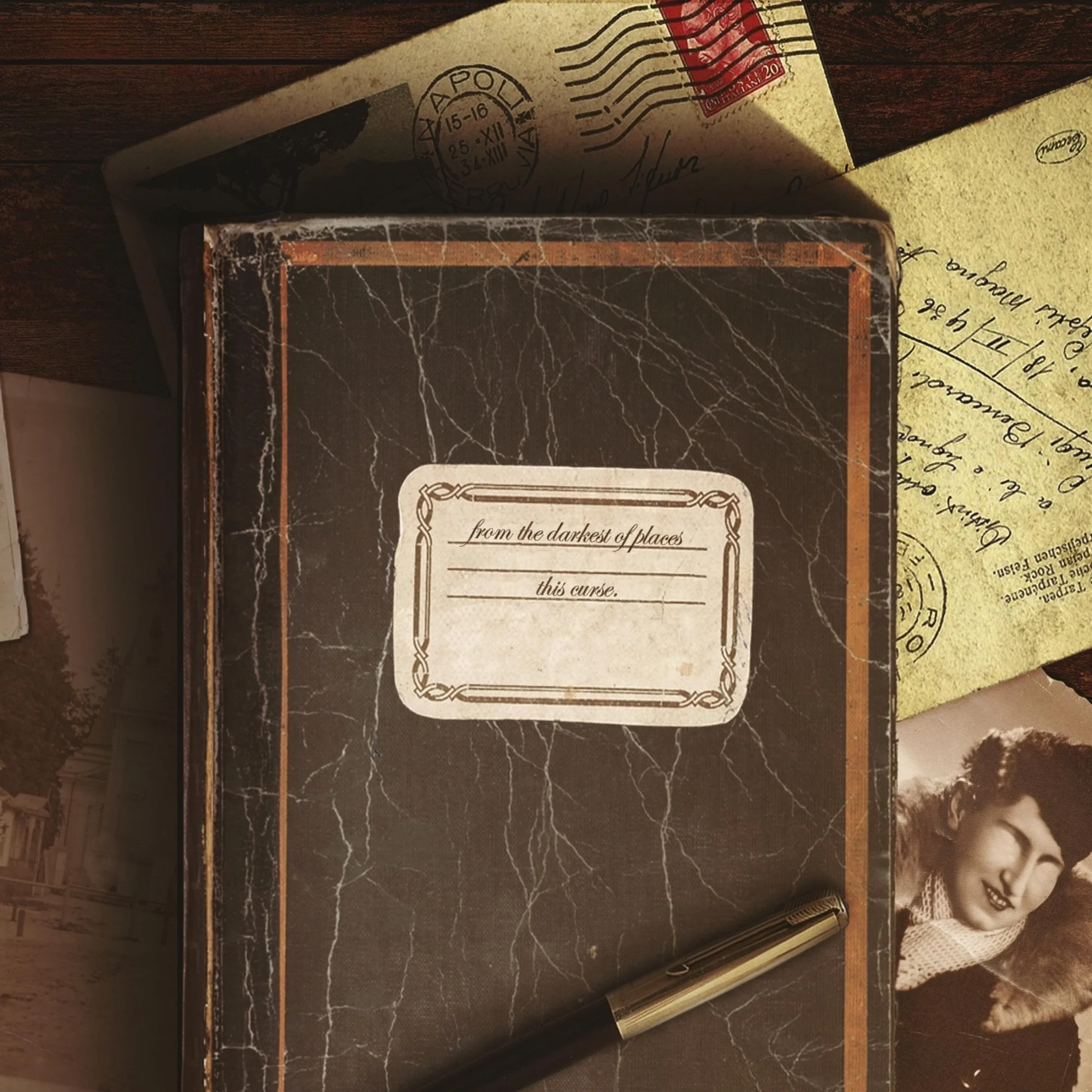 A vintage book with a black marble cover and orange border, lying on a dark wooden surface. Around the book are various papers, including a handwritten letter and an envelope with a postmark and a red postage stamp.