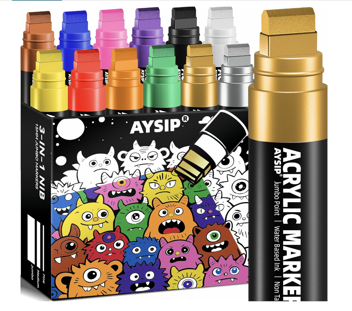 Colorful set of acrylic markers in a box with cartoon monster illustrations on it.