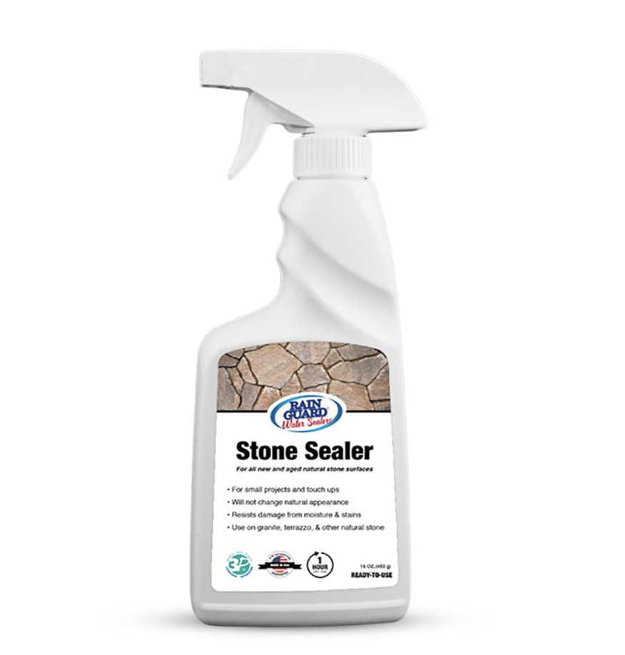 White spray bottle labeled 'Stone Sealer' by Rain Guard Water Sealers, with a cracked stone background on the front label.