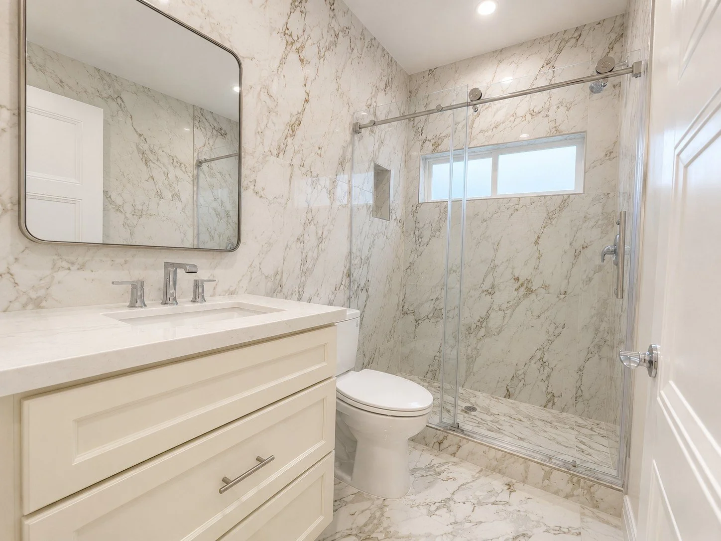 Custom walk-in shower with glass enclosure construction in Los Angeles