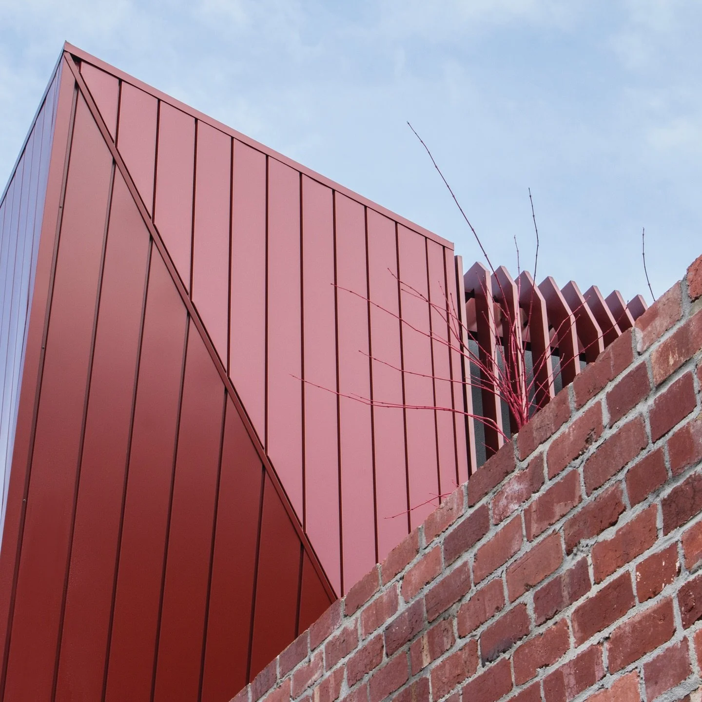 The striking O&rsquo;Grady House. @advancedmetalcladding mixing Manor Red Colorbond Cladding with heritage bricks.