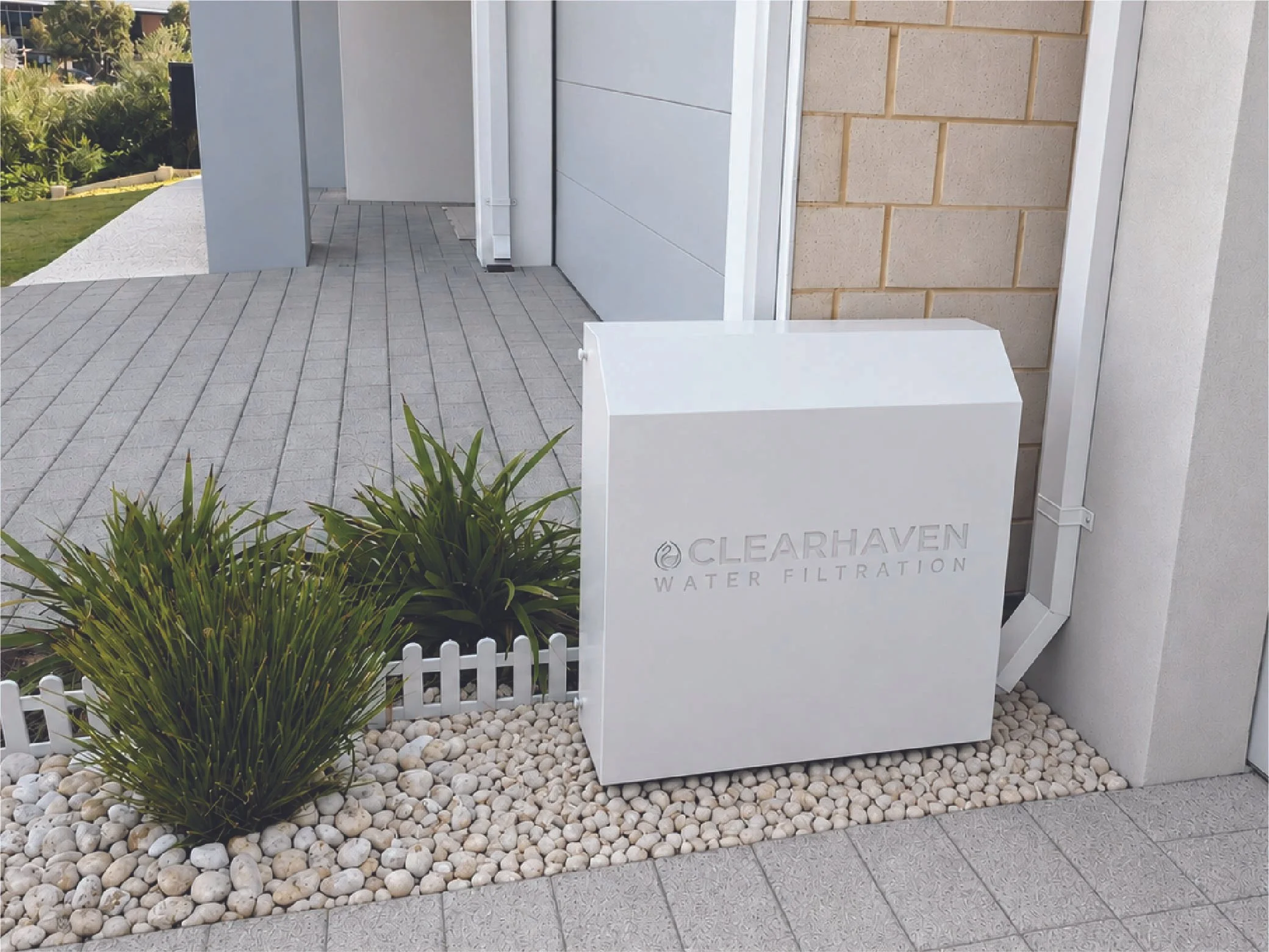 ClearHaven whole-home water filtration system with a custom Surfmist Colourbond cover seamlessly integrated into a Perth home.