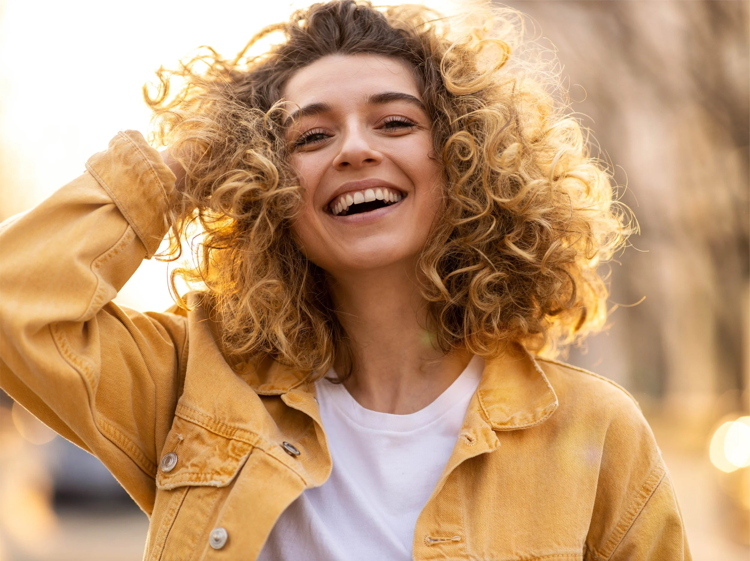 Woman with healthier, softer hair after switching to a ClearHaven whole-home water filtration system in Perth.