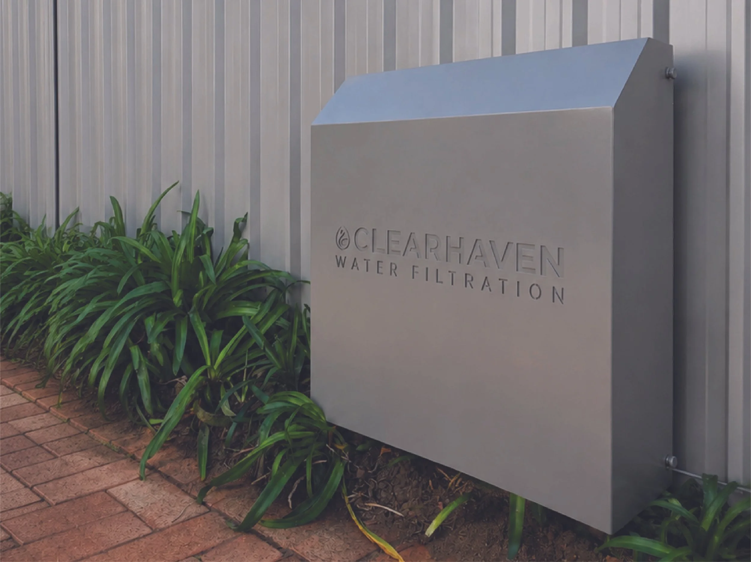 ClearHaven Gully water filtration unit installed beside garden path in Atwell