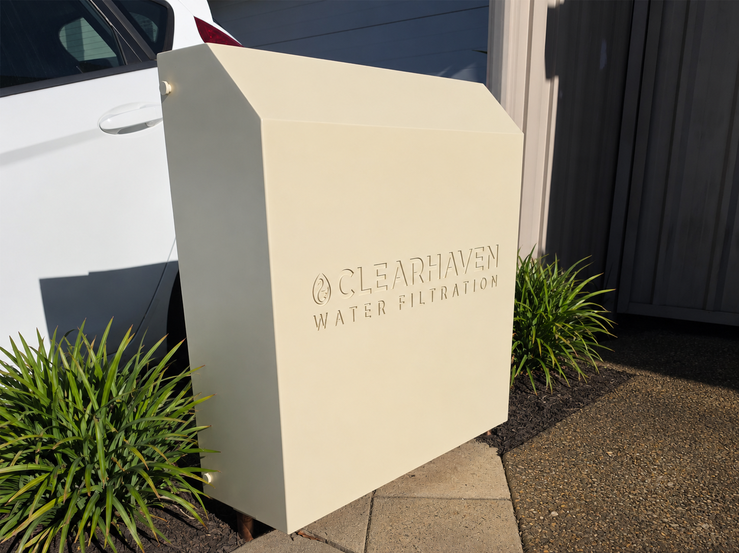 ClearHaven whole-home water filtration system with a custom Classic Cream Colourbond cover designed to complement a Perth home.