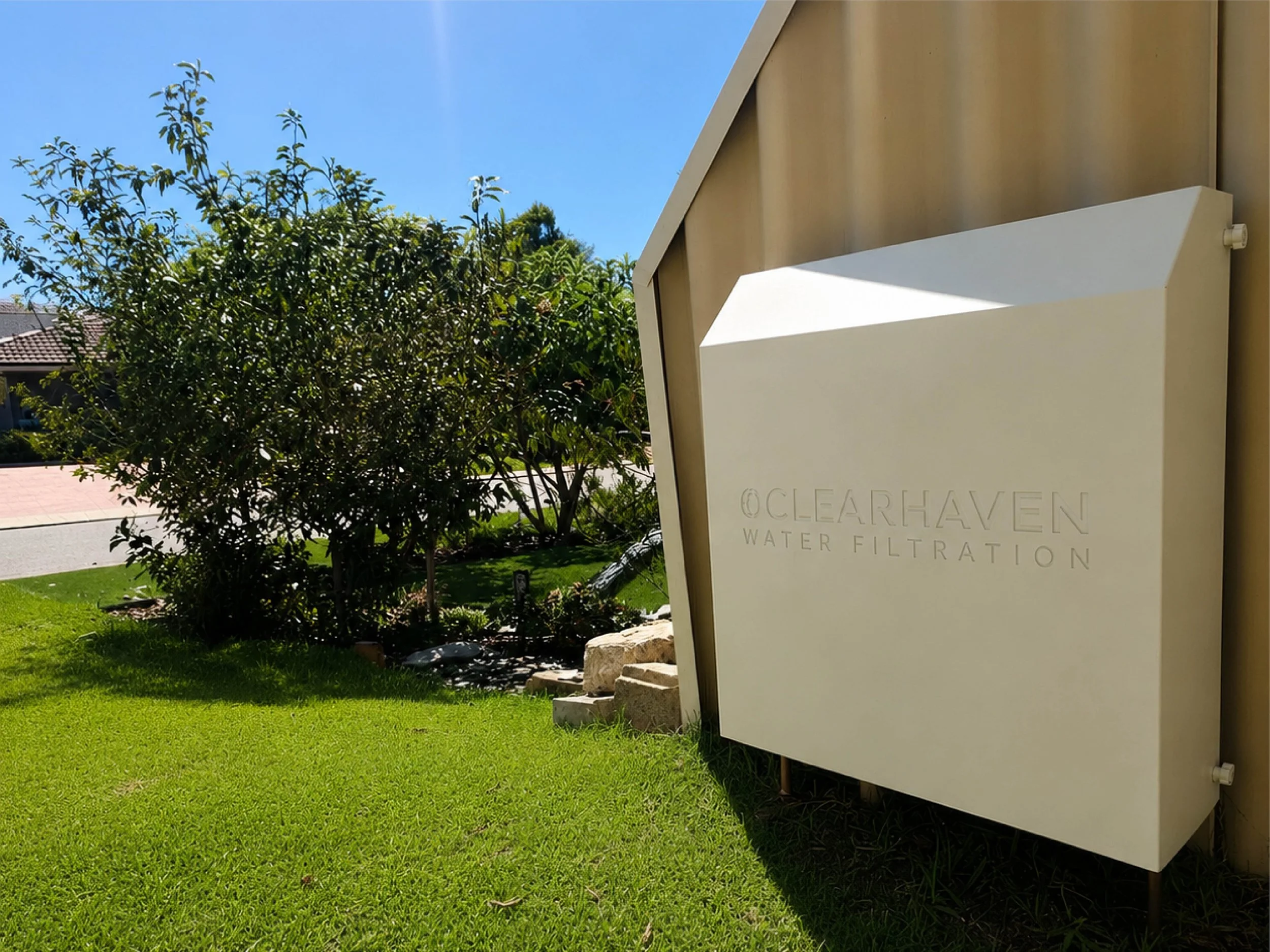 ClearHaven whole-home water filtration system with a custom Classic Cream Colourbond cover designed to complement a Perth home.