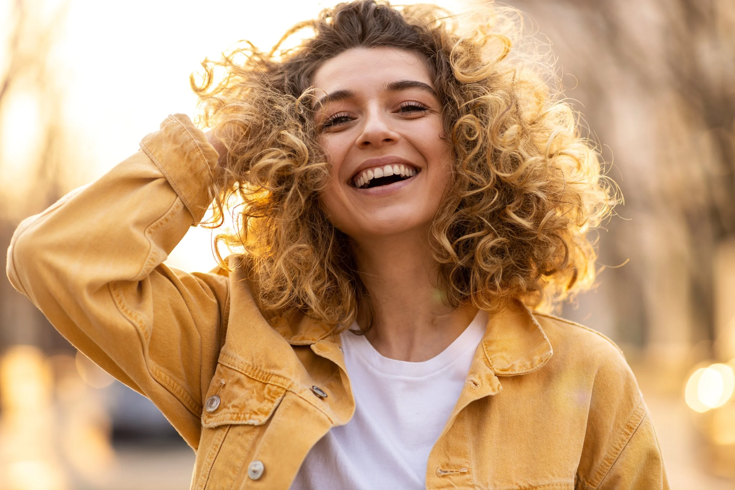 Woman with soft, healthy-looking hair, demonstrating the benefits of ClearHaven whole-home water filtration for reducing chlorine and supporting healthier hair in Perth homes.