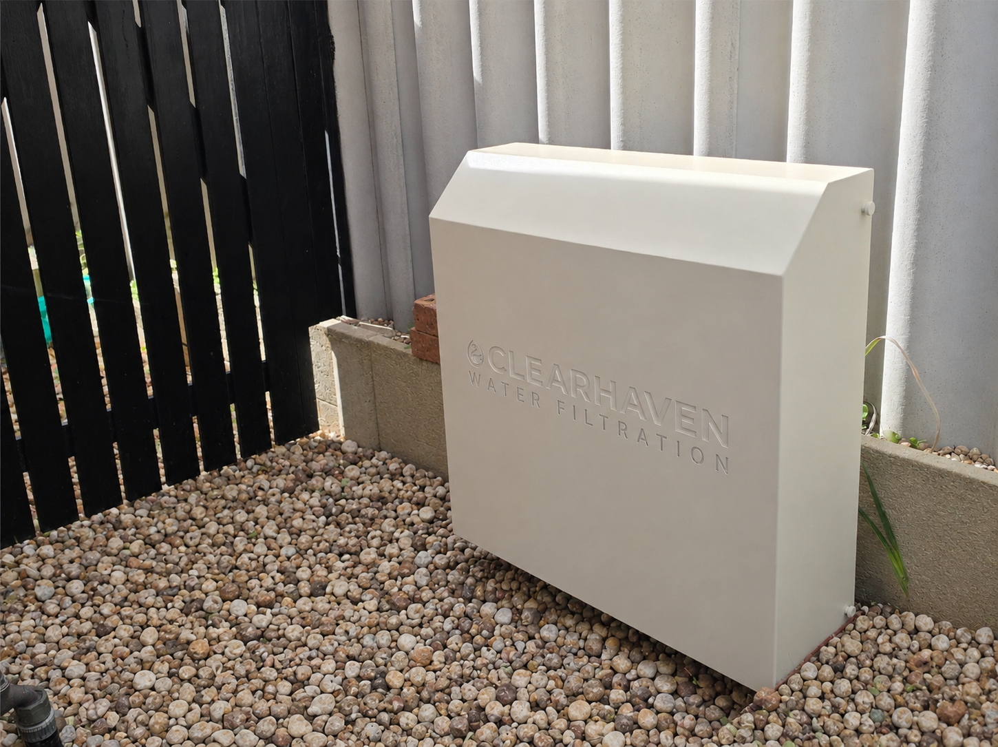 ClearHaven whole-home water filtration system with a custom powder-coated aluminium cover, professionally installed to reduce chlorine throughout a Perth home.