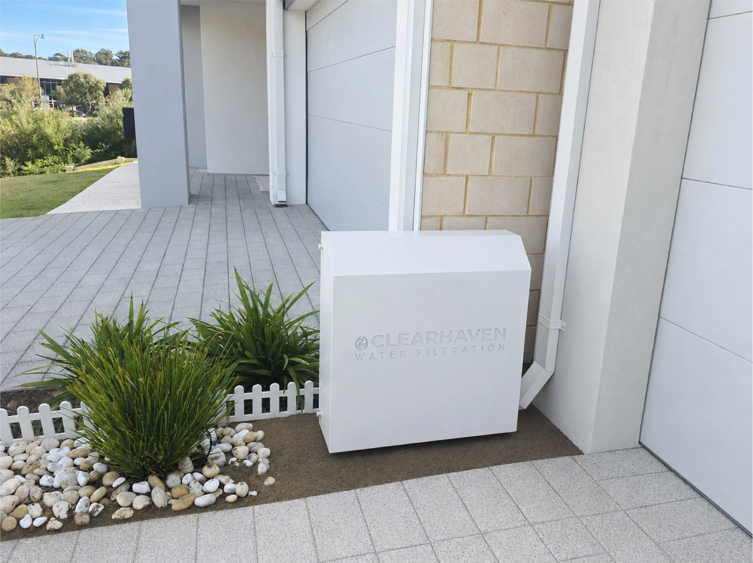 ClearHaven whole-home water filtration system with a custom Surfmist Colourbond cover seamlessly integrated into a Perth home.