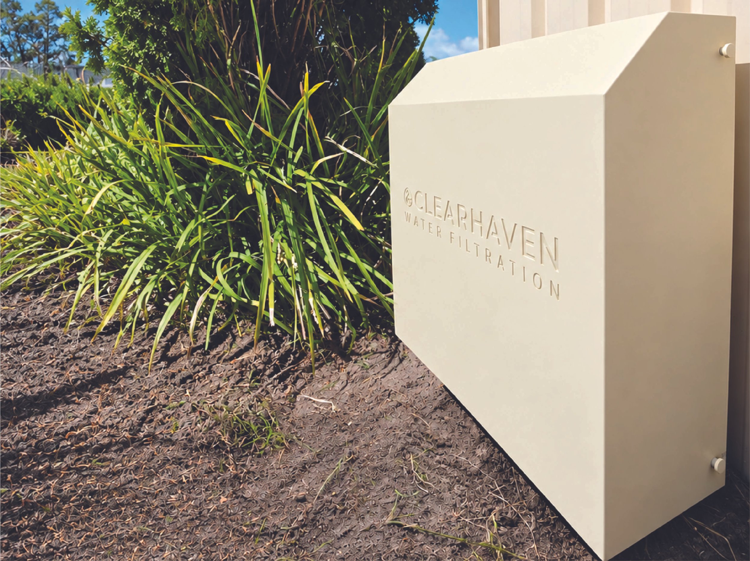 ClearHaven whole-home water filtration system installed beside a landscaped garden in Perth.