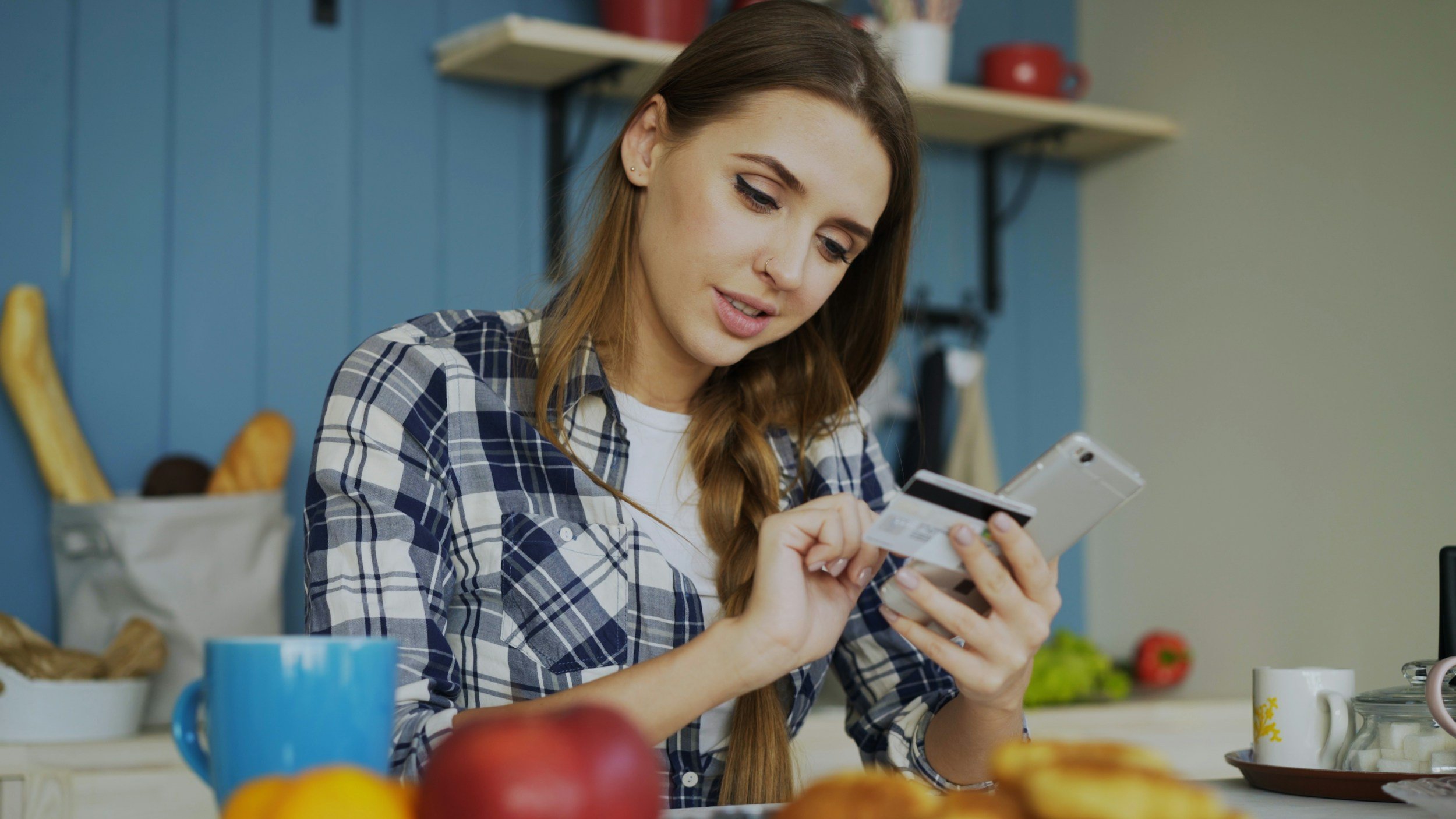 woman paying with a card