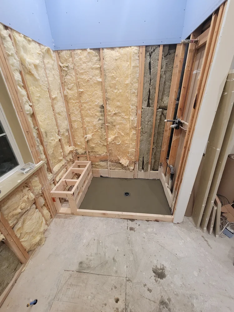 Shower area before tile renovation