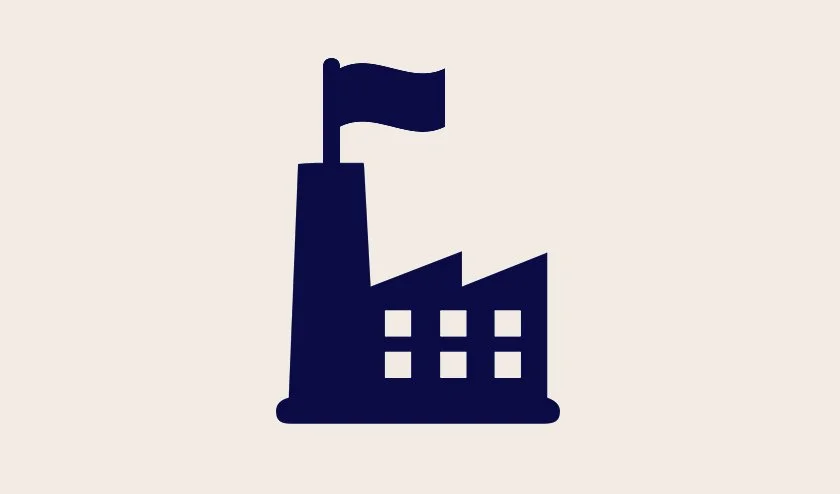 Icon of a factory building with a flag on top