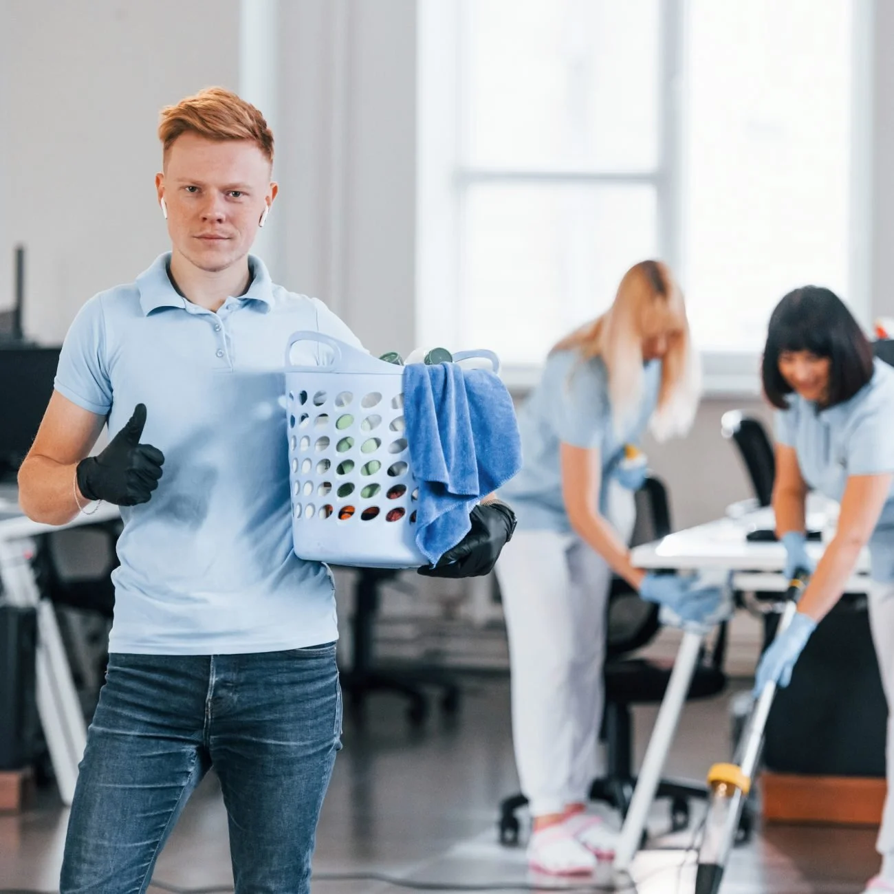 man-holds-basket-group-workers-clean-modern-office-together-daytime-1300x1300.jpg