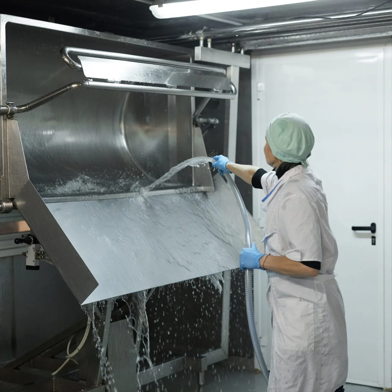 portrait-female-worker-washing-curdling-machine-workshop-cheesemaking-factory-copy-space-1300x1300.jpg