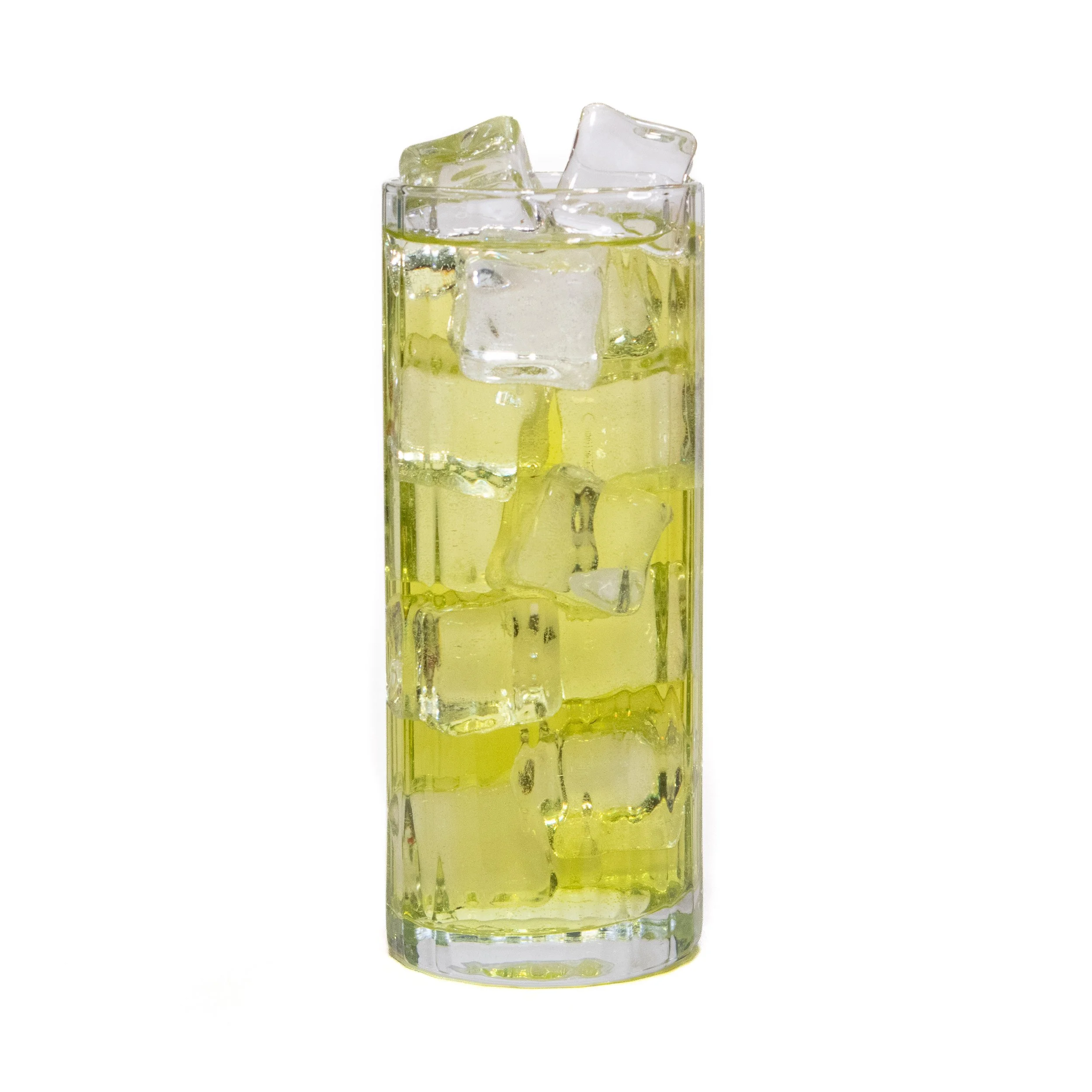 A tall glass filled with green liquid and ice cubes.